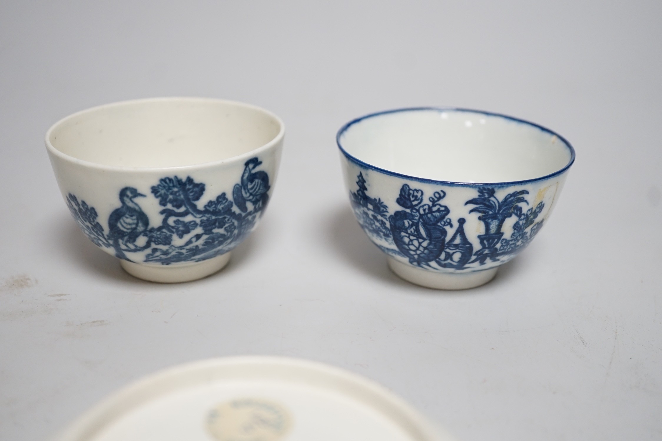 An 18th century Caughley teabowl and saucer printed with 'Mother and Child' and 'Birds in Branches', saucer 12cms diameter